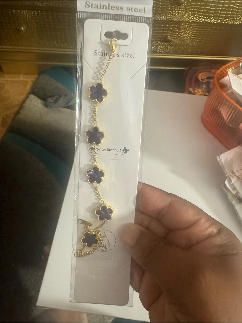 Gold-Tone Bracelet with dark purple Four-Leaf Flower Accents